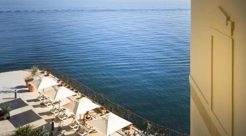 a view of the ocean from a building at Apartments Belvedere - by Liburnia Hotels & Villas in Lovran