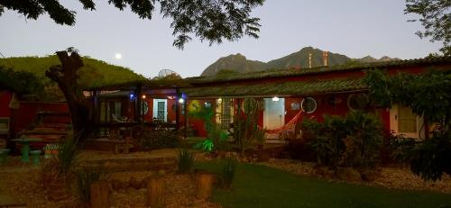 a house with lights on the front of it at Casa Dos Artistas in Penedo