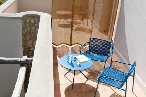 a table and two chairs on a balcony at Laqua Countryside in Vico Equense