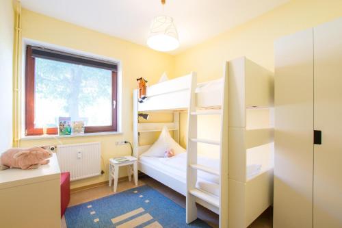 Postel nebo postele na pokoji v ubytování Ferienhof Kluvetasch Appartement Nr 1 - Ostseekrabbe