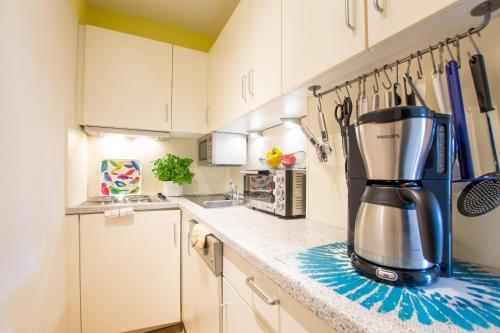 a kitchen with a coffee maker on a counter at Ferienhof Kluvetasch Appartement Nr 3 - Seestern in Rettin