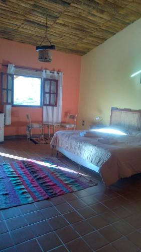 Una cama o camas en una habitación de hosteria camino del inca