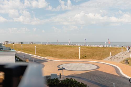a view of a park with the ocean in the background at SeaScape in Norderney