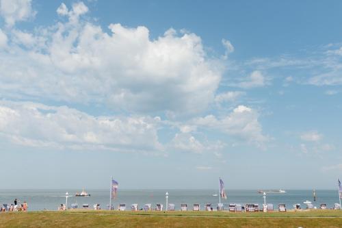 a group of people standing on the beach at SeaScape in Norderney