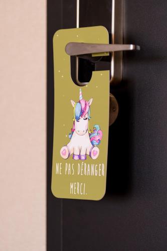 a door tag with a unicorn on it at Hotel D Bulle - La Gruyère in Bulle