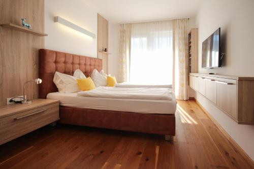 Un pat sau paturi într-o cameră la Planai West by Schladming Appartements