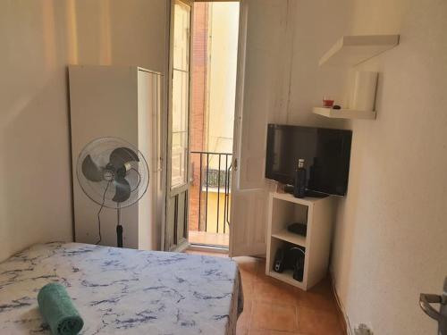 A bed or beds in a room at Parque El Retiro Madrid