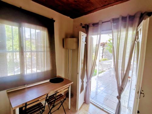 a home office with a desk and a window at Country House in Sozopoli