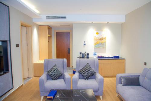 Coin salon dans l'établissement Hôtel FAMILLE MONDIALE