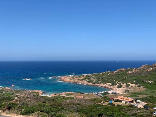 a view of a beach with the ocean at Villa Infinity in Tergu