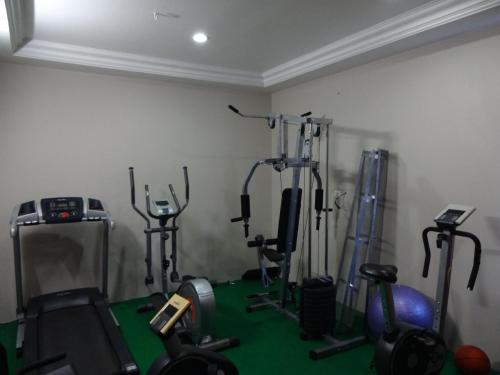 
a room filled with lots of different types of equipment at Hotel Green Palace in Pondicherry

