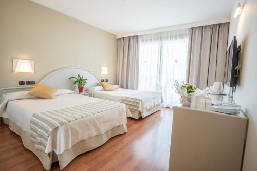 Ένα ή περισσότερα κρεβάτια σε δωμάτιο στο Gran Hotel Costa del Sol