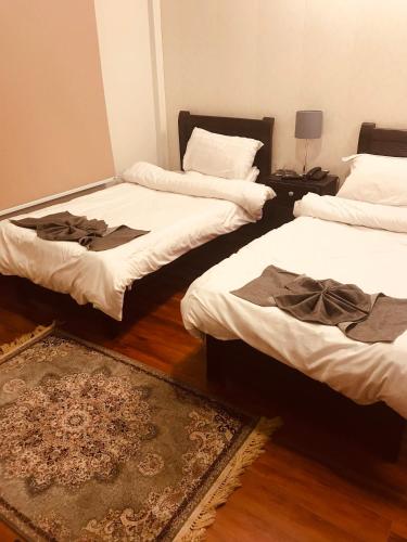 Postel nebo postele na pokoji v ubytování Boutiqueinn Ayubia
