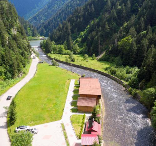 arial view of a river with a house in the middle at Raha Villa Bungalow in Uzungol