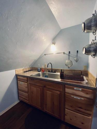 a kitchen with a sink and a counter top at Diamond Apartment with GYM - 2 miles to Fort Sill & just blocks to downtown! in Lawton