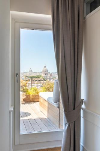 a window with a view of a city at Hotel Scalinata Di Spagna in Rome