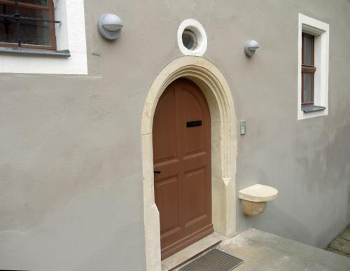 a wooden door on the side of a building at Pfarrhaus Maxen in Müglitztal