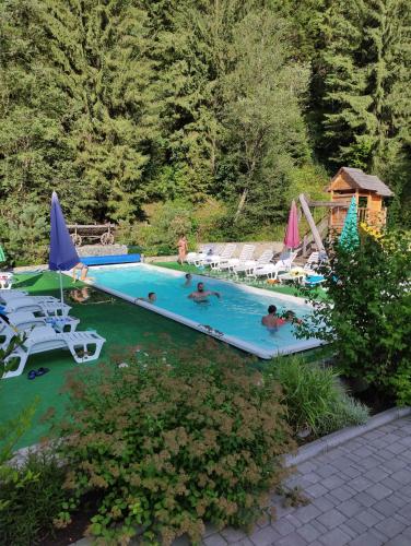 a group of people swimming in a swimming pool at Cheremosh in Yablunytsya