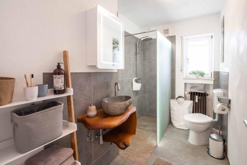 a bathroom with a sink and a toilet at Ferienwohnung Rhön (Er) Leben in Sondheim