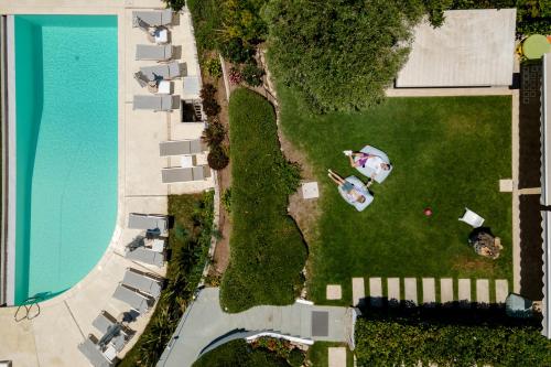 an aerial view of a yard with a pool at Akti Elia Villas Beachfront Chalkidiki in Elia