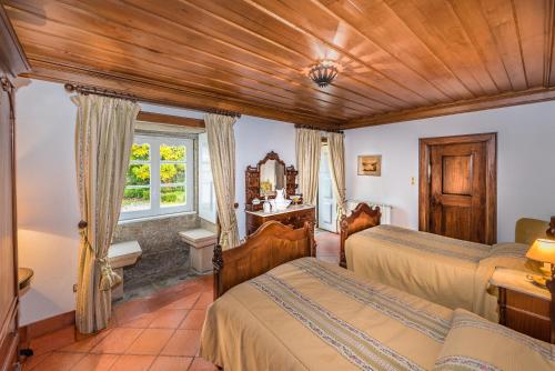 Postel nebo postele na pokoji v ubytování Paço de Calheiros - Turismo de Habitação
