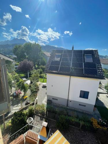 a house with solar panels on the roof at Silvia's Bed und Breakfast in Luzern in Luzern
