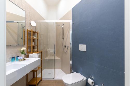 a bathroom with a shower and a toilet and a sink at iFlat Lovely and comfortable flat in Prati in Rome