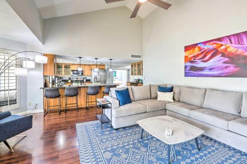 a living room with a couch and a table at 3 Mi to Kierland! Luxe Desert Home with Heated Pool in Scottsdale