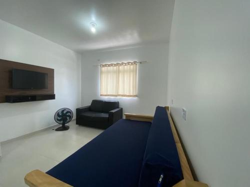 a living room with a ping pong table and a couch at Condominio Boa Vista in Pontal do Paraná
