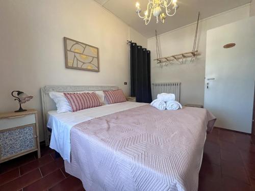 a bedroom with a bed with two towels on it at Tenuta delle Acque in Acquasparta