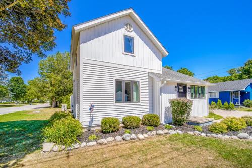 a white house with a yard at Harbor Charm in Harbor Springs