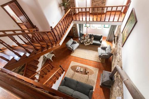 an overhead view of a living room with a staircase at Casa das Regueiras in Santiago de Compostela