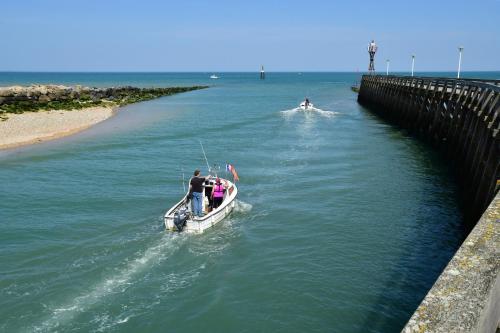 a group of people on a boat in the water at Appt centre de Courseulles - 100m de la plage in Courseulles-sur-Mer