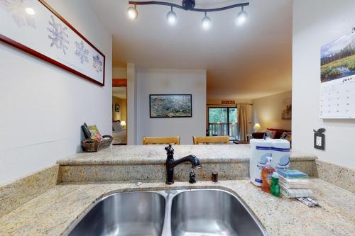 a kitchen with a sink and a counter top at The Summit 206 in Old Mammoth