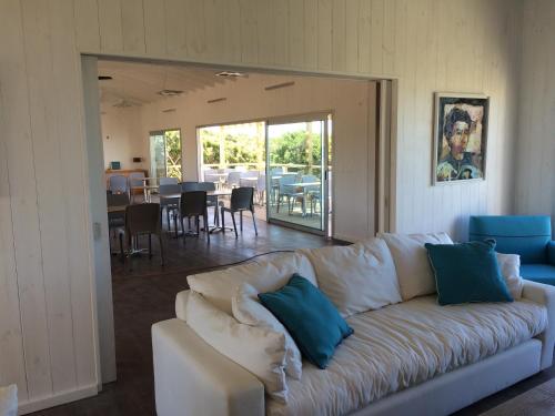 a living room with a couch and a dining room at Las Eduardas in La Paloma