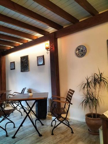 a dining room with a table and chairs at Hotel Mary's House in Selcuk