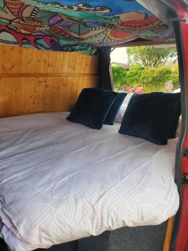 a bed in the back of a van at VW Campervan in Pembrokeshire