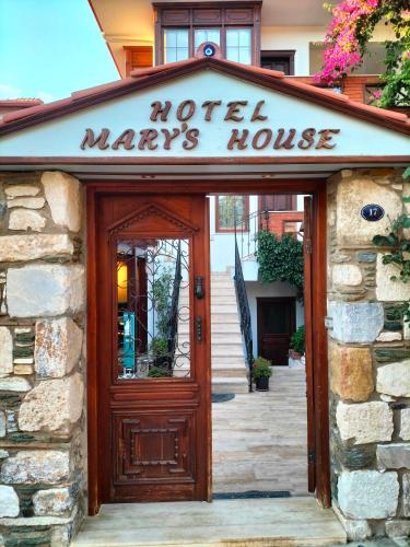 a sign over the door of a motel mavericks house at Hotel Mary's House in Selcuk