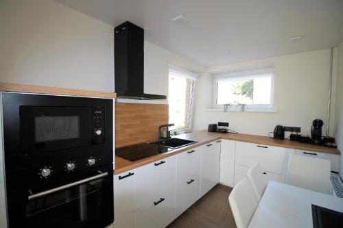Kuchyň nebo kuchyňský kout v ubytování BAM apartments