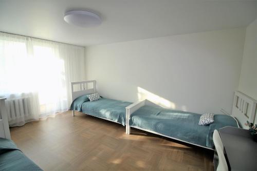 Postel nebo postele na pokoji v ubytování BAM apartments