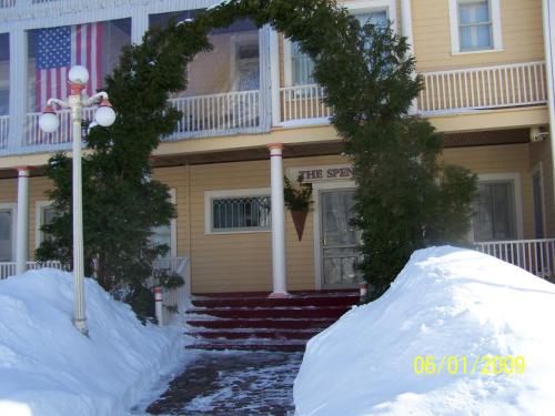 a pile of snow in front of a house at Spencer Hotel & Spa Chautauqua in Chautauqua