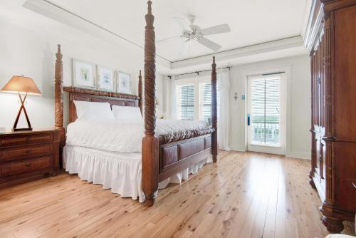 a bedroom with a bed and a ceiling fan at Watercolor Townhouse 9 in Seagrove Beach