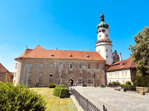 a castle with a lighthouse on top of it at Apartmán Elen in Nové Město nad Metují