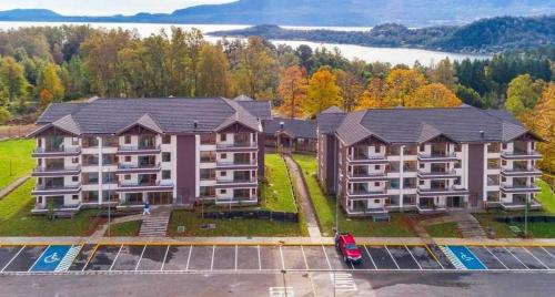 an overhead view of an apartment building with a parking lot at Pucon villarrica in Pucón