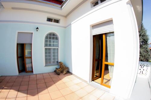 a teddy bear sitting on the floor of a house at Villa Delbia - L'Elfo in Candelo