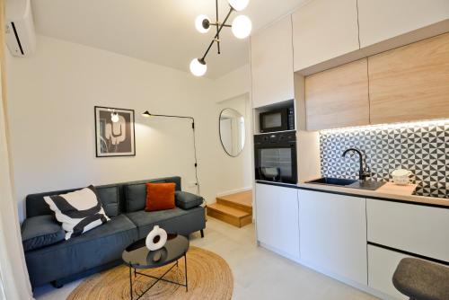 a living room with a couch and a kitchen at Apartment Luka in Zadar