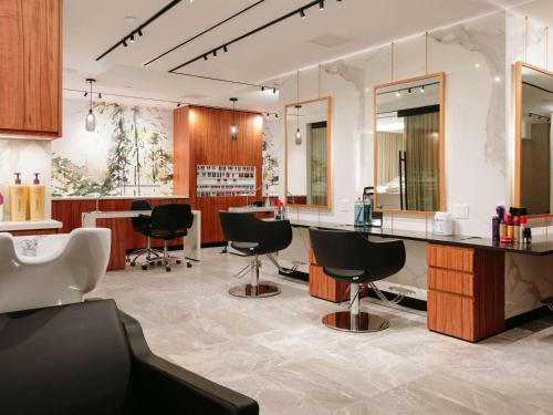 a hair salon with black chairs and a counter at Fairmont Banff Springs in Banff