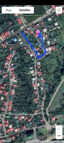 a map of a parking lot with a blue arrow at Family Guest House Marso in Ssatschcheri
