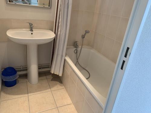 a bathroom with a sink and a toilet and a shower at Appartement Dives-sur-Mer, 2 pièces, 4 personnes - FR-1-487-236 in Dives-sur-Mer