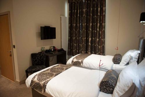 Ein Bett oder Betten in einem Zimmer der Unterkunft Hotel Forty One